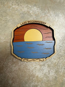 Decorative wall art with a wooden texture, water design, and text on a textured surface.